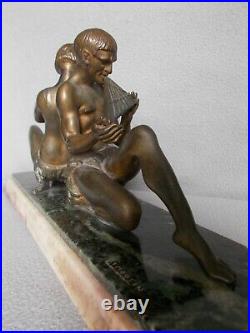 Sculpture art deco LIMOUSIN femme nue homme faune statue en regule patine bronze